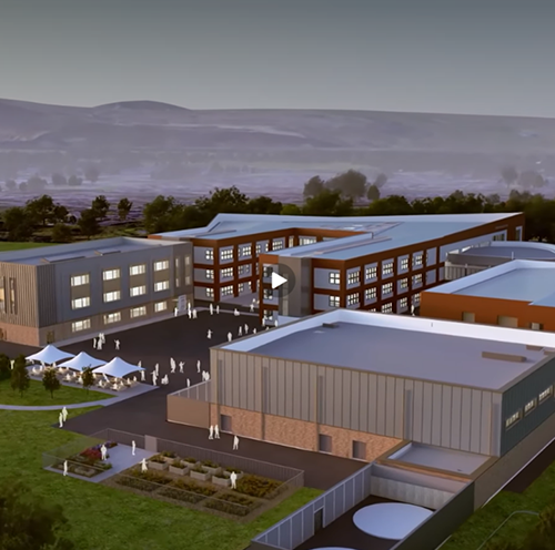 Architectural rendering showing an aerial view of a modern school campus with multiple two- and three-storey buildings, landscaped grounds, outdoor seating areas, and sports facilities set within a rural landscape.